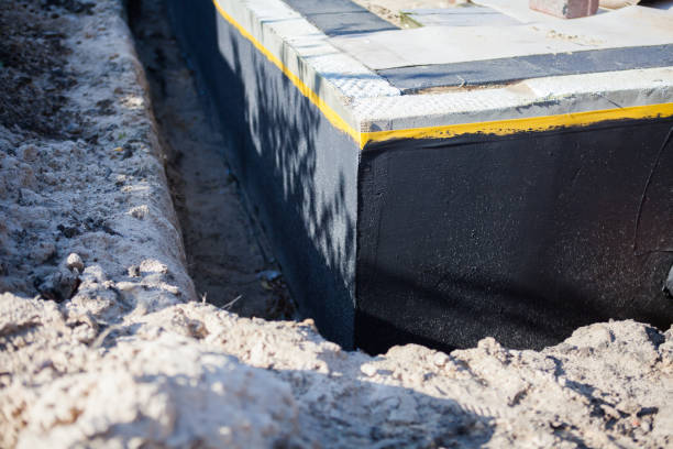 Professional Waterproofing technician working in Commerce Township, MI